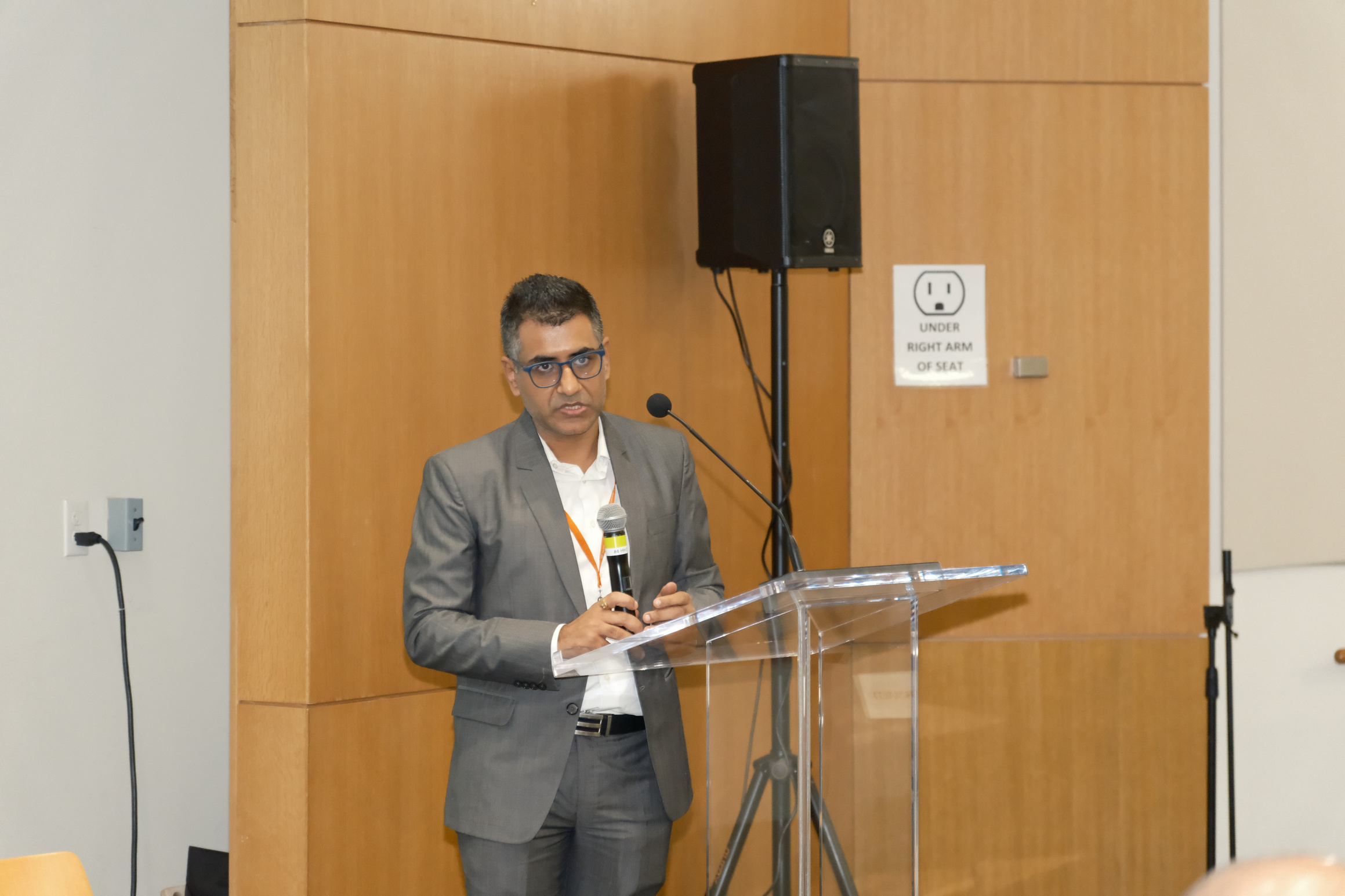 Dheeraj Pandey at the podium, QxBio 2025