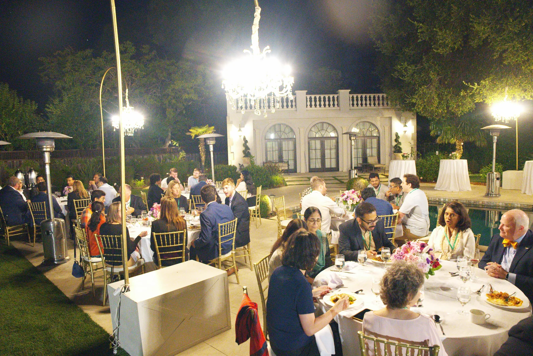 QxBio attendees connecting at an evening gathering